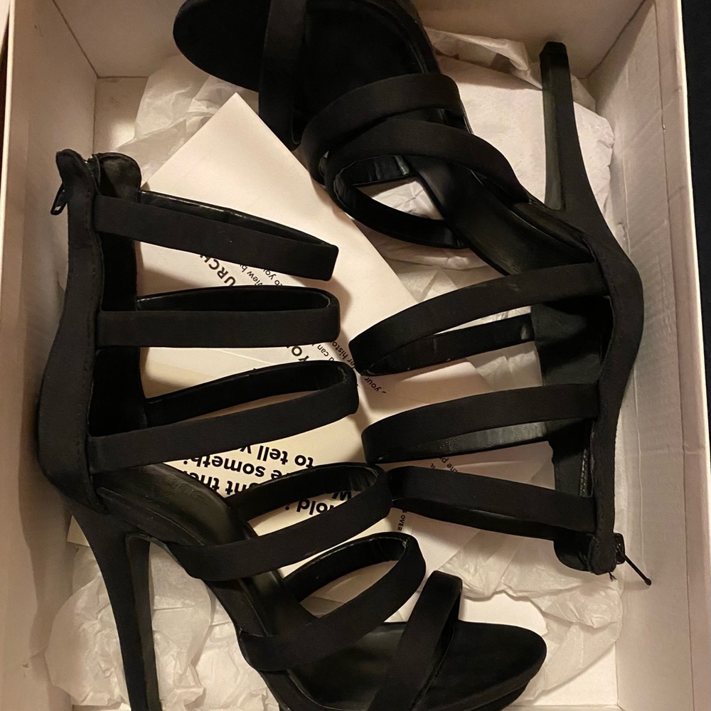 Lace up black high heels. Comfortable fit and perfect for going out. Size 7.